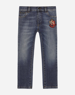 SLIM-FIT BLUE WASH JEANS WITH HERALDIC PATCH