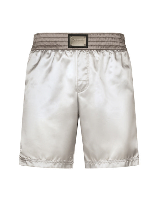 MID-LENGTH SWIM TRUNKS WITH BANDS AND LOGO TAG
