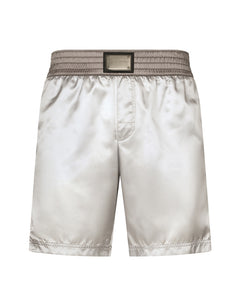 MID-LENGTH SWIM TRUNKS WITH BANDS AND LOGO TAG