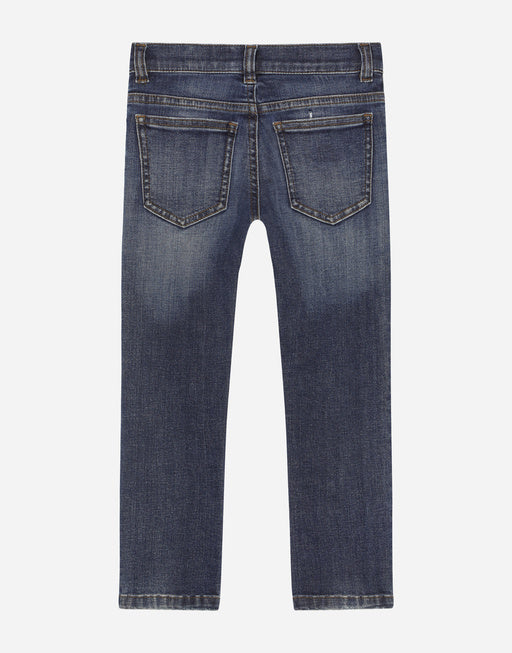 SLIM-FIT BLUE WASH JEANS WITH HERALDIC PATCH