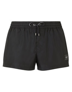 SHORT SWIM TRUNKS WITH BRANDED PLATE