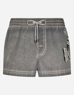 SHORT PRINTED SWIM TRUNKS