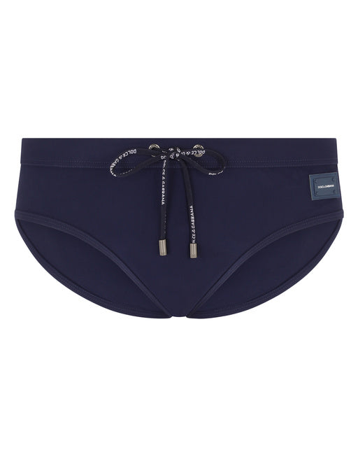 SWIM BRIEFS WITH HIGH-CUT LEG AND BRANDED PLATE