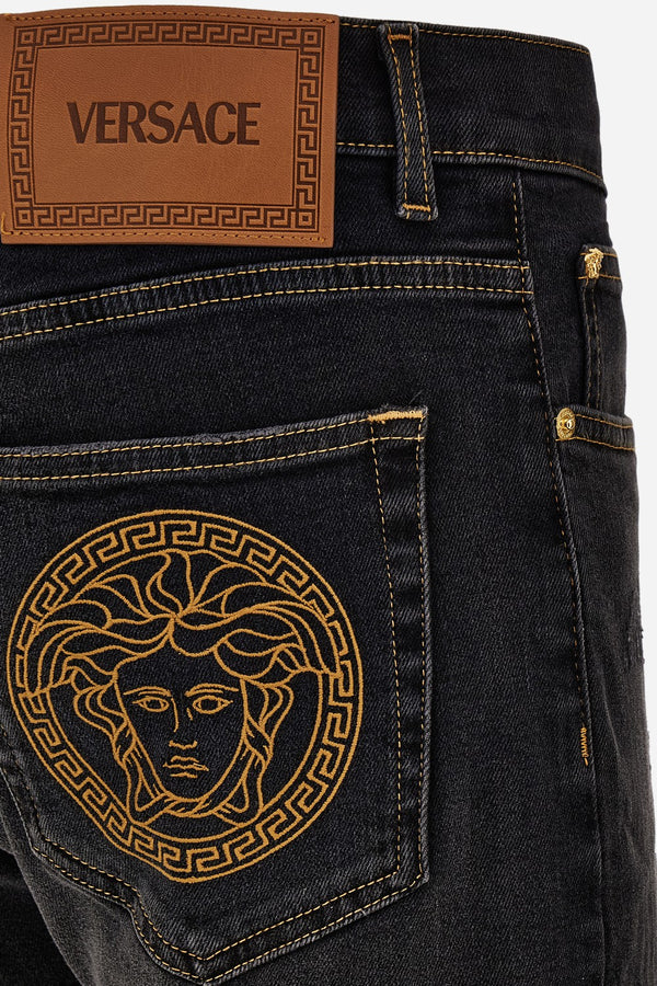 Pant Denim In Black Stretch Denim-Stone Wash-Rips And Mustaches-Medusa Embroidery