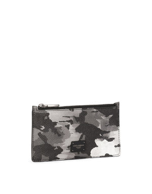 DAUPHINE CALFSKIN CARD HOLDER WITH LEOPARD PRINT AGAINST A GRAY BACKGROUND