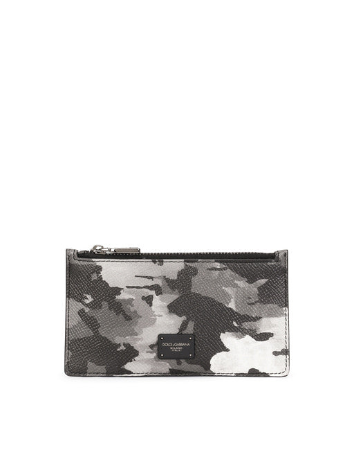 DAUPHINE CALFSKIN CARD HOLDER WITH LEOPARD PRINT AGAINST A GRAY BACKGROUND