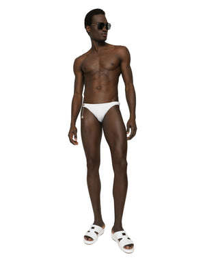 SWIM BRIEFS WITH LOGO PLATE AND COIN CHARM