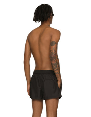 SHORT SWIM TRUNKS WITH BRANDED PLATE