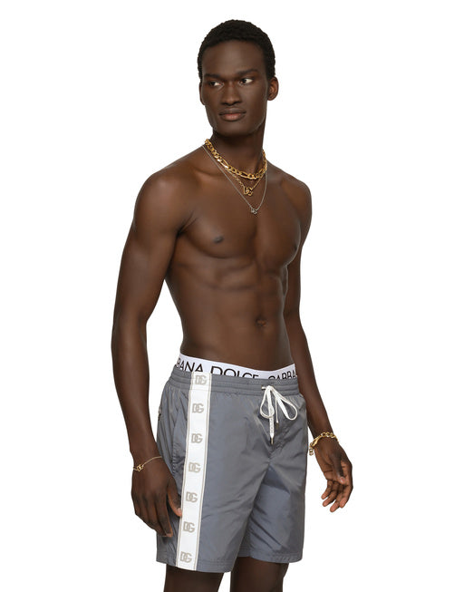 MID-LENGTH SWIM TRUNKS WITH BRANDED BANDS