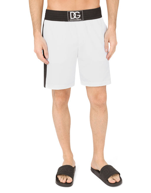 TWO-TONE MID-LENGTH SWIM TRUNKS WITH DG PATCH