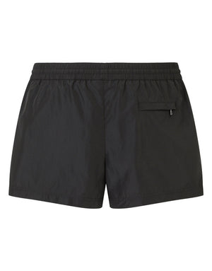 SHORT SWIM TRUNKS WITH BRANDED PLATE