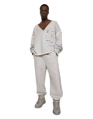 PRINTED JOGGING PANTS WITH SMALL ABRASIONS