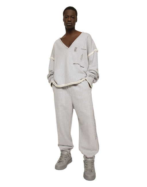PRINTED JOGGING PANTS WITH SMALL ABRASIONS