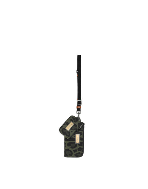 NYLON MULTI-PURPOSE KIT WITH LEOPARD PRINT AGAINST A GREEN BACKGROUND AND BRANDED PLATE