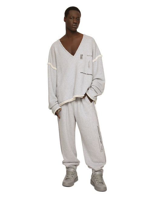 PRINTED JOGGING PANTS WITH SMALL ABRASIONS