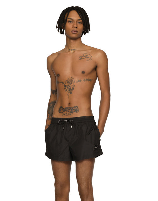 SHORT SWIM TRUNKS WITH BRANDED PLATE
