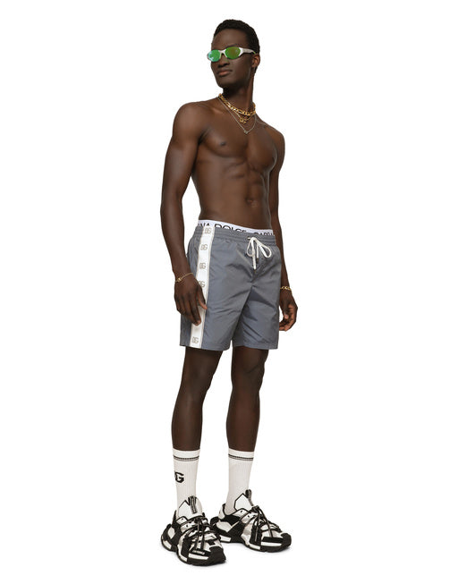 MID-LENGTH SWIM TRUNKS WITH BRANDED BANDS