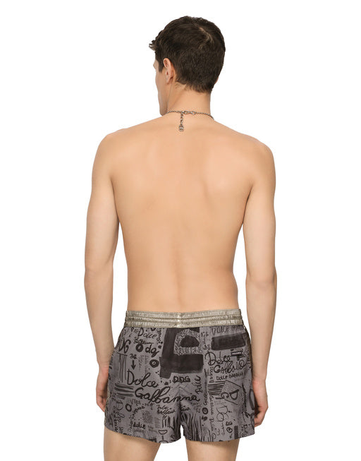 SHORT SWIM TRUNKS WITH LOGO PRINT