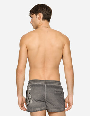 SHORT PRINTED SWIM TRUNKS