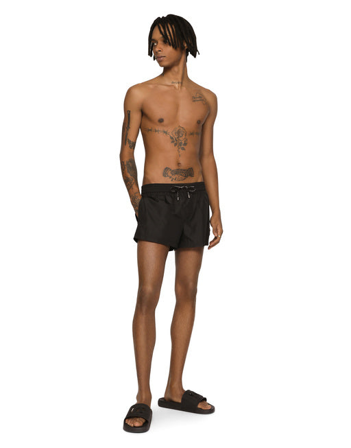SHORT SWIM TRUNKS WITH BRANDED PLATE