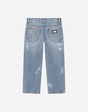 WASHED DENIM JEANS WITH ABRASIONS