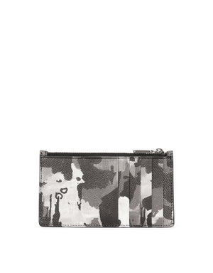 DAUPHINE CALFSKIN CARD HOLDER WITH LEOPARD PRINT AGAINST A GRAY BACKGROUND
