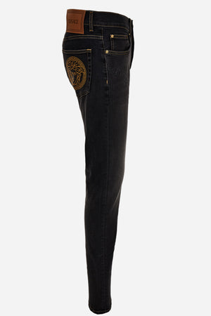 Pant Denim In Black Stretch Denim-Stone Wash-Rips And Mustaches-Medusa Embroidery