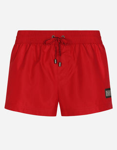 SHORT SWIM TRUNKS WITH BRANDED TAG