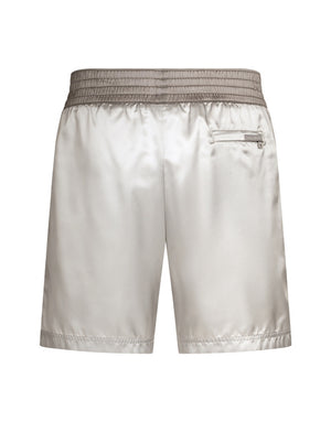 MID-LENGTH SWIM TRUNKS WITH BANDS AND LOGO TAG
