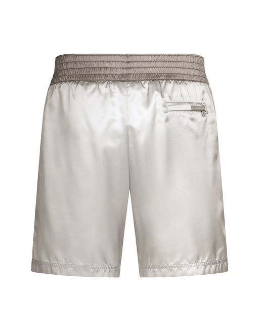 MID-LENGTH SWIM TRUNKS WITH BANDS AND LOGO TAG
