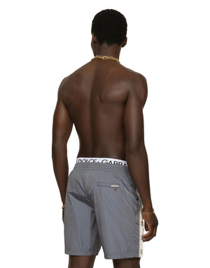 MID-LENGTH SWIM TRUNKS WITH BRANDED BANDS