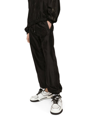 TECHNICAL SILK JOGGING PANTS WITH HERALDIC EMBROIDERY