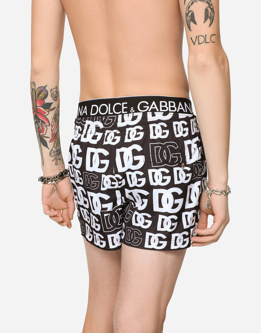 SHORT SWIM TRUNKS WITH ALL-OVER DG PRINT