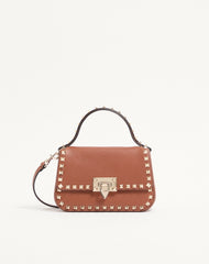 BORSA PICCOLA A MANO ROCKSTUD IN VITELLO GRANATO
