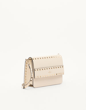 BORSA PICCOLA A TRACOLLA ROCKSTUD IN VITELLO GRANATO
