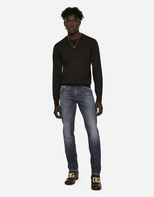 SLIM FIT WASHED STRETCH JEANS WITH SUBTLE ABRASIONS