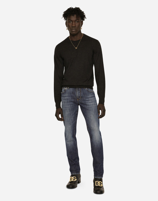 SLIM FIT WASHED STRETCH JEANS WITH SUBTLE ABRASIONS