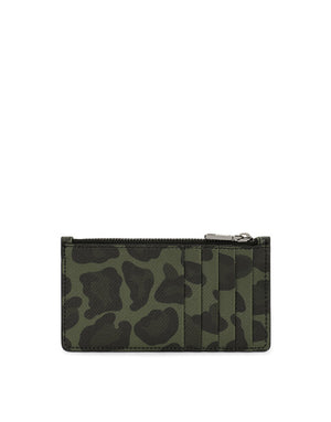 DAUPHINE CALFSKIN CARD HOLDER WITH LEOPARD PRINT AGAINST A GRAY BACKGROUND