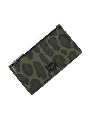 DAUPHINE CALFSKIN CARD HOLDER WITH LEOPARD PRINT AGAINST A GRAY BACKGROUND