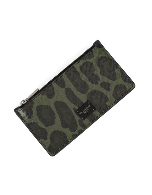 DAUPHINE CALFSKIN CARD HOLDER WITH LEOPARD PRINT AGAINST A GRAY BACKGROUND