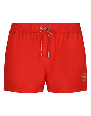 SHORT SWIM TRUNKS WITH BRANDED PLATE