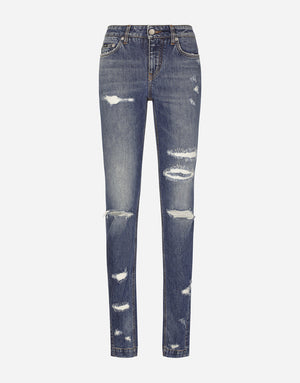 GIRLY JEANS WITH RIPPED DETAILS