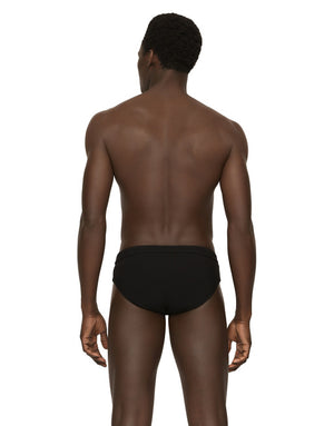 SWIM BRIEFS WITH HIGH-CUT LEG AND BRANDED PLATE