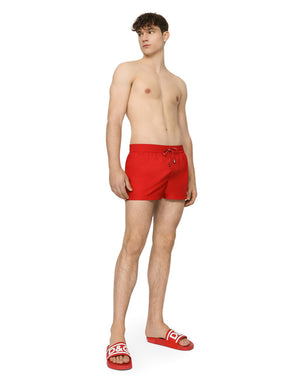 SHORT SWIM TRUNKS WITH BRANDED PLATE