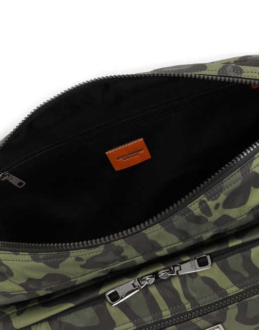 NYLON MESSENGER BAG WITH A LEOPARD PRINT AGAINST A GREEN BACKGROUND AND BRANDED PLATE
