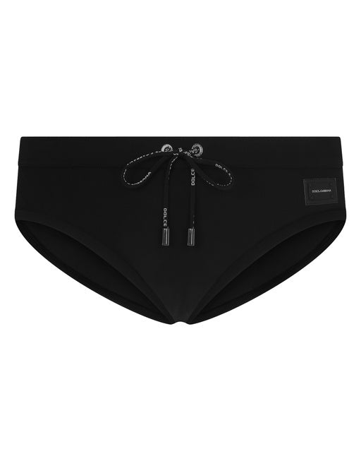 SWIM BRIEFS WITH HIGH-CUT LEG AND BRANDED PLATE