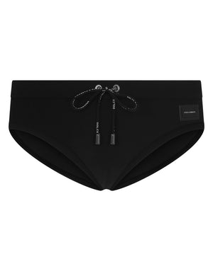 SWIM BRIEFS WITH HIGH-CUT LEG AND BRANDED PLATE