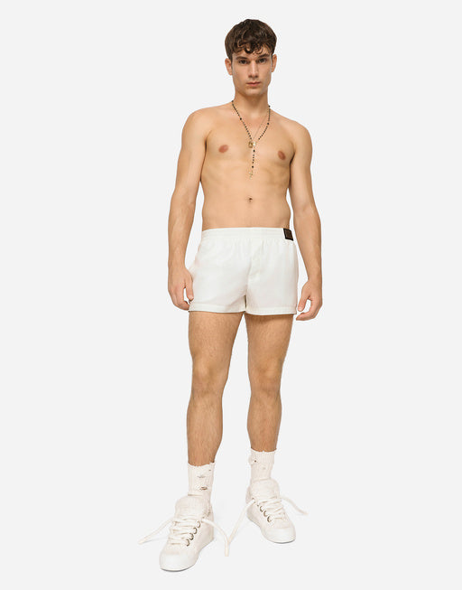 SHORT SWIM TRUNKS WITH BRANDED TAG