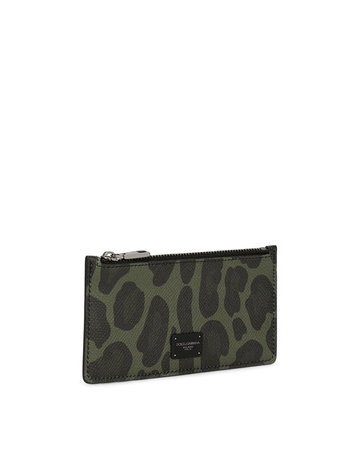 DAUPHINE CALFSKIN CARD HOLDER WITH LEOPARD PRINT AGAINST A GRAY BACKGROUND