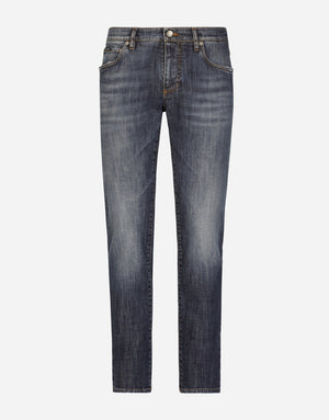 SLIM FIT WASHED STRETCH JEANS WITH SUBTLE ABRASIONS